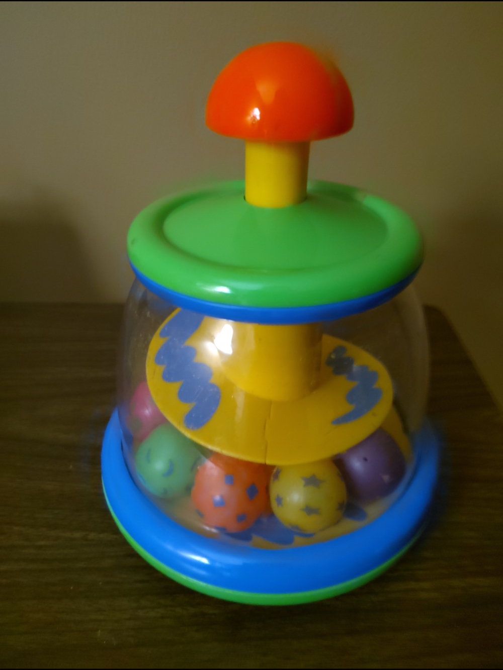 Infantino Colorful Spinning Ball Pop Toy - Green, Blue, Yellow, Orange - Vintage